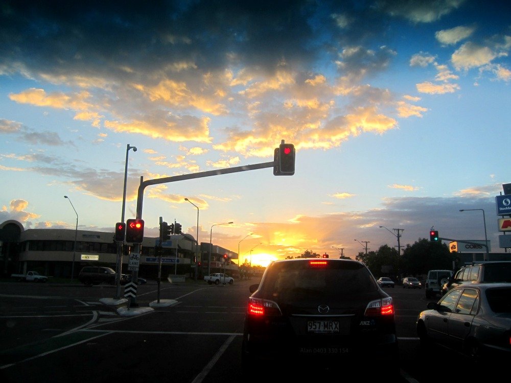 Traffic Lights and the sinking sun at 6.17 p.m.